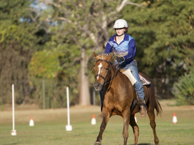 A girl rides her horse at an equestrian event at the kununurra ag show 2026