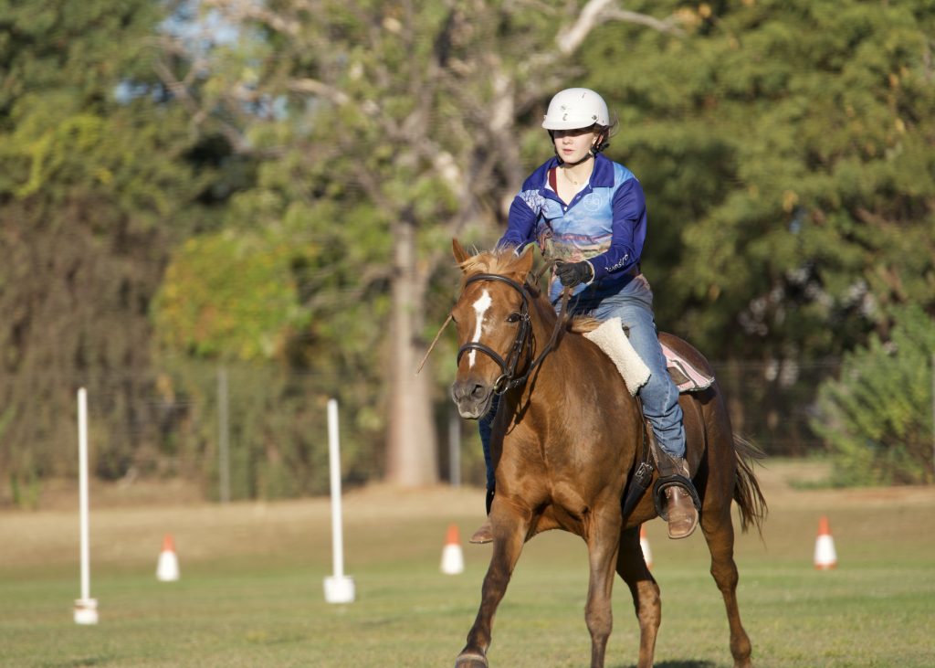 A girl rides her horse at an equestrian event at the kununurra ag show 2026