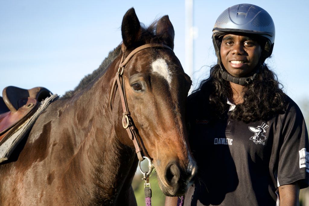 A young woman with her horse in Kununurra WA