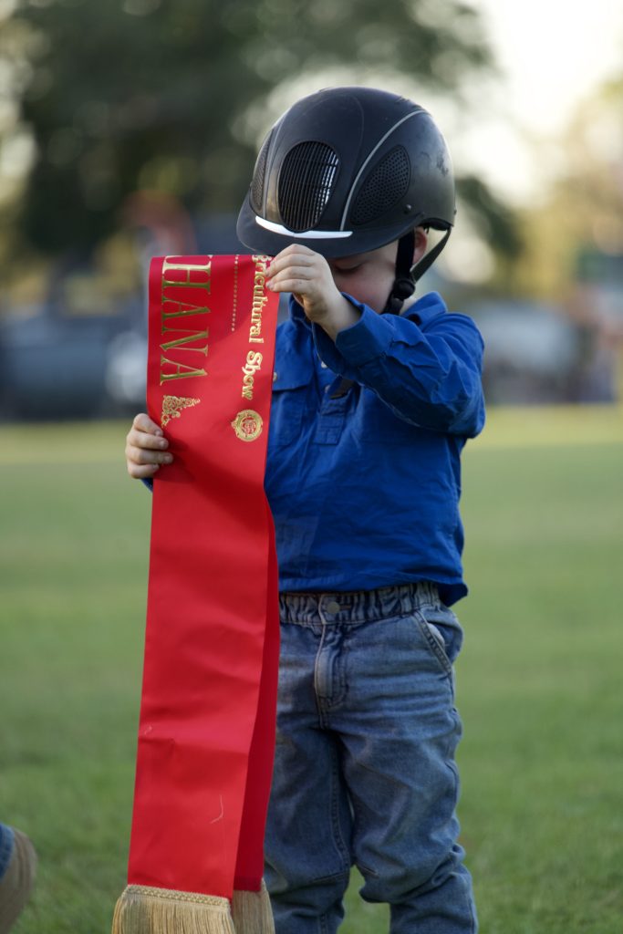 a boy wins at ribbon at an equestrian event at the kununurra ag show 20206