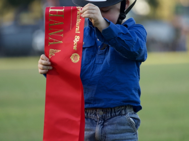 a boy wins at ribbon at an equestrian event at the kununurra ag show 20206